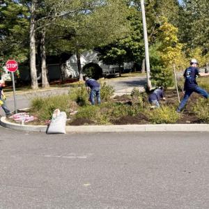 Camden National Bank employees gather for some roadside clean up at the Boys and Girls Club in Gardiner during their dedicated Community Well-being Day. (Photo courtesy Camden National Corporation)