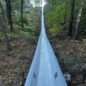 Abe Rhode, Kristi Van Blarcom, Ian Bogey, David Garner paint the toboggan chute with a fresh coat of white paint Oct. 5. (Photo courtesy Peter Berke)
