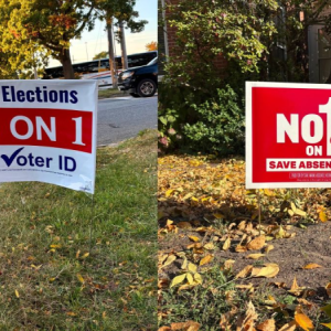 Photos by Stephanie McFeeters. yard signs for both sides of the issue addressed in question 1.
