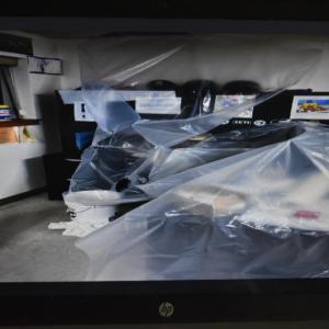 Offices and computers are protected from rain storms and plumbing problems by plastic sheets.