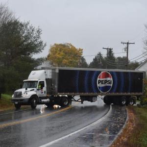 freightliner backing into parking lot to turn around