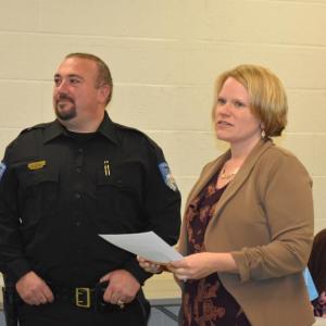 Town Manager Kara George (c) introduces Thomaston's new police chief, Eric Quatrano, at the official swearing-in ceremony at the start of a Select Board meeting, Oct. 15, 2025. (Photo by Sarah Thompson)