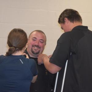 Eric Quatrano's children help with the pinning ceremony. (Photo by Sarah Thompson)