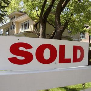 Photo credit: MetroCreative sold sign outside of a house.