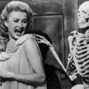 Scene from House on Haunted Hill. (Photo courtesy Rockland Public Library) Woman screams as skeleton taps her on the shoulder