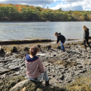 (Photo courtesy Charles Lagerbom) Students walk on top of the remains of a shipwreck
