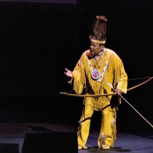 Passamaquoddy language teacher and cultural preservationist Dwayne Tomah performs onstage at the Waterville Opera House’s September presentation of Portland Ovations’ production of Wabanaki Stories. (Photo by John Meader) Passamaquoddy language teacher and cultural preservationist Dwayne Tomah performs onstage