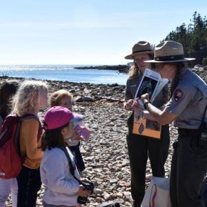 Adult Scout leaders teach a lesson