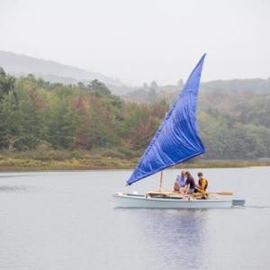 The catamaran, The Snail, sets sail with its test sail, a tarp. (Photo courtesy David Garrison)