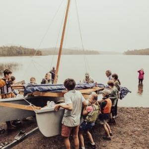 It takes community to launch a boat (Photo courtesy David Garrison)