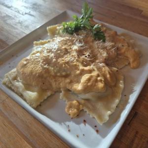 Savory pumpkin cream sauce over four-cheese ravioli for a T-Day side dish. Photo by Kay Stephens