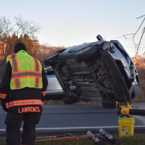 Chain attached to vehicle undercarriage pulls vehicle to the ground