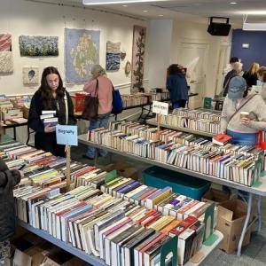 People looking at books at a book sale