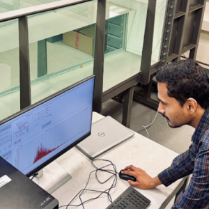 Adult male works at computer station
