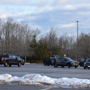 Law enforcement vehicles in a parking lot