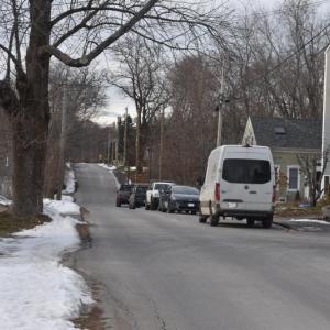 vehicles parked along a residential street