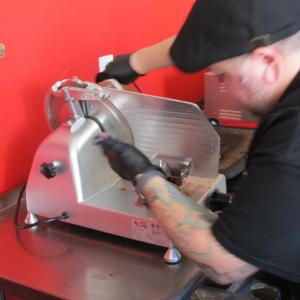 Williams at the slicer. Photo by Kay Stephens