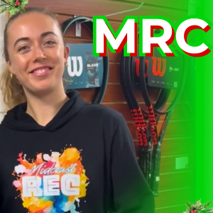 A girl wearing an MRC sweatshirt stands next to a display of sweatshirts, with other gift options displayed on the side