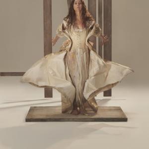 Female standing, skirt like wings