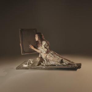 Female lounging, holding frame