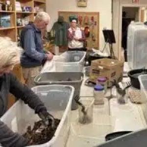 People working with items in bins