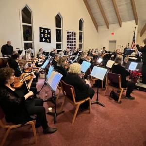 Concert in venue with red-ish carpet