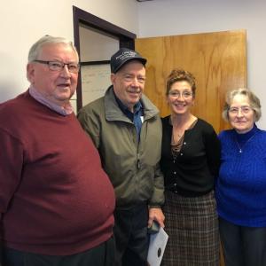 (Right to left) standing next to Commissioner Amy Fowler, Treasurer David Parkman, Commissioner William Shorey.