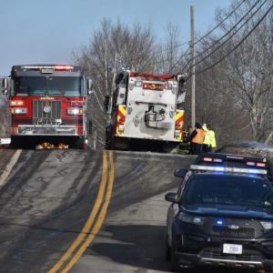 full road closure with police cruiser, two fire trucks
