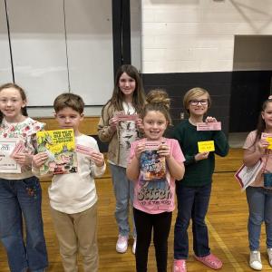 Six students show off their raffle wins