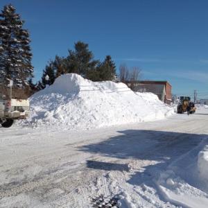 large snow pile at side of road