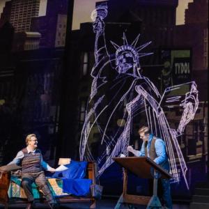 Two men, large sketch of Statue of Liberty