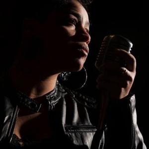 Kenya Hall close up at mic