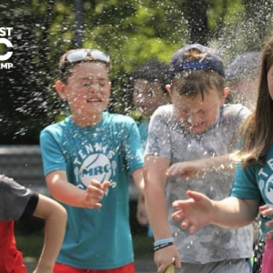 Kids laughing and playing outside at a Midcoast Rec summer camp