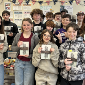 School class holds their copies of a book