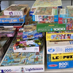 stacks of jigsaw puzzle boxes