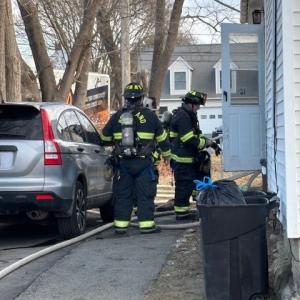 firefighters at kitchen door