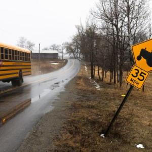school bus driving down a street.