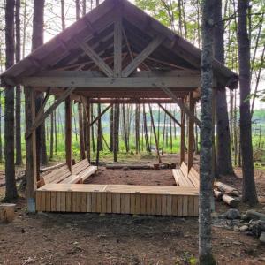 wooden structure with bench seats