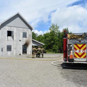 building with fire truck, water supply