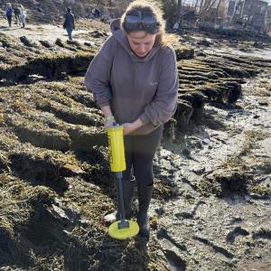 upclose picture of female student using piece of equipment