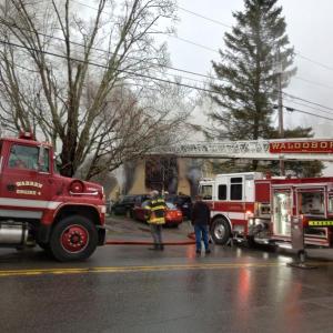 Firefighters from Warren, Waldoboro, Thomaston and Union battle an early morning fire that broke out around 6 a.m. in a downtown Warren apartment building. (Photo by Sarah Thompson)