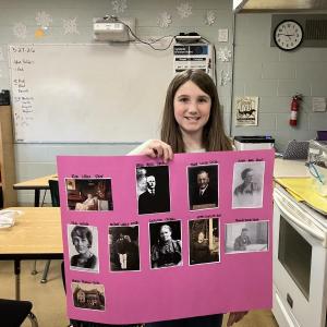 Nora Smith holds picture tree 