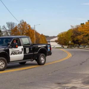 a law enforcement vehicle blocks a road.