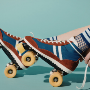 A pair of roller skates being laced up