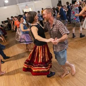 couple dances among other dancers