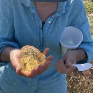 person holds items in her hands