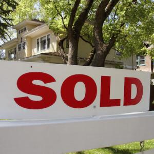 sold sign outside of a house.