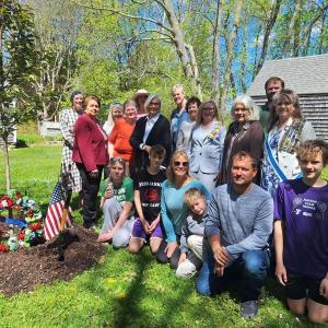 large group photo next to seedling