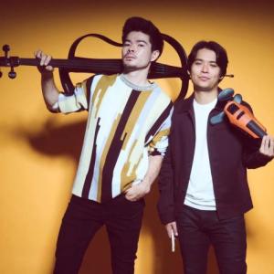 two males holding instruments
