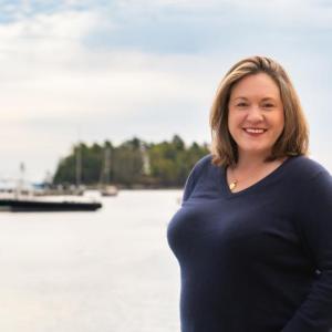 woman with harbor backdrop